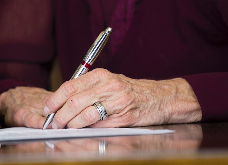 Elderly signing